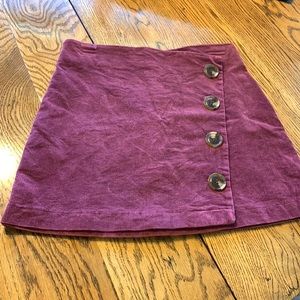 Maroon corduroy 4 buttons skirt. Zips In back.